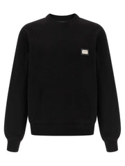 Dolce & Gabbana schwarzer Baumwoll-Sweatshirt mit Lederpatch und Logo-Tag