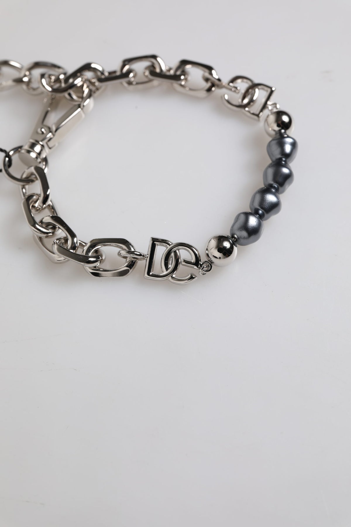 Dolce & Gabbana bracelet with silver-tone chain, lobster clasp, logo, and grey pearls