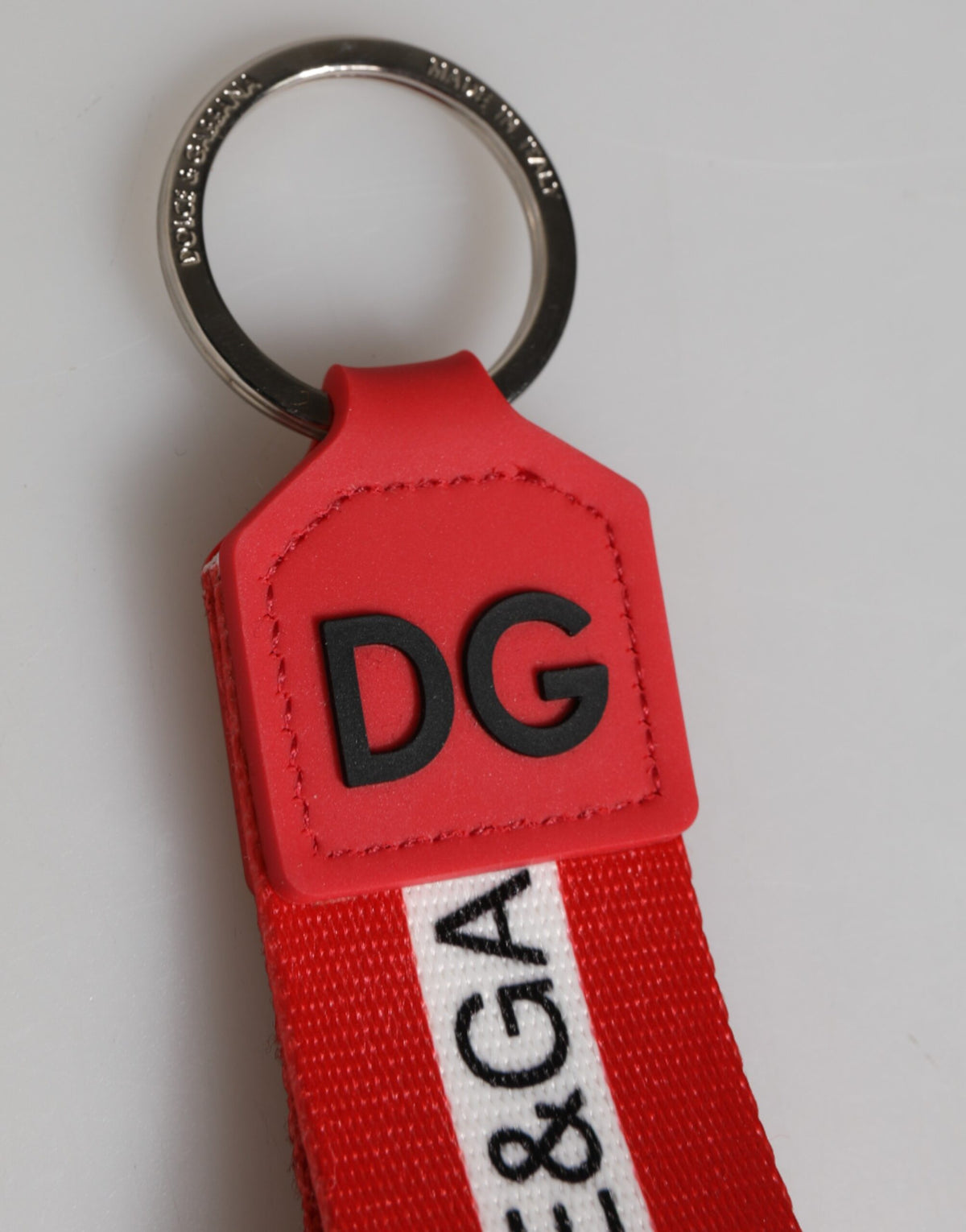 Dolce & Gabbana polyester keychain with red logo, silver brass holder